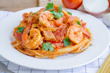 Macaroni, shrimp & bacon  with tomato sauce.