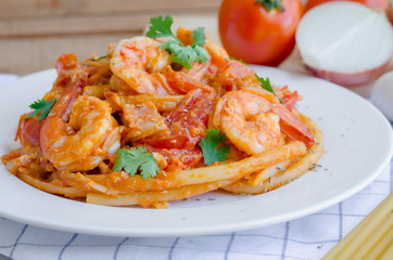 Macaroni, shrimp & bacon  with tomato sauce.