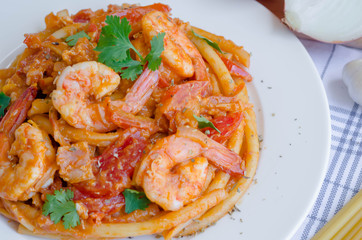 Macaroni, shrimp & bacon  with tomato sauce.