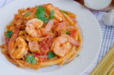 Macaroni, shrimp & bacon  with tomato sauce.