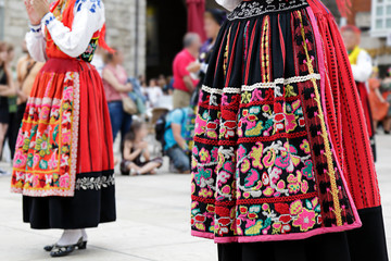 Woman dancing and wearing one of the traditional folk costume from Portugal - obrazy, fototapety, plakaty