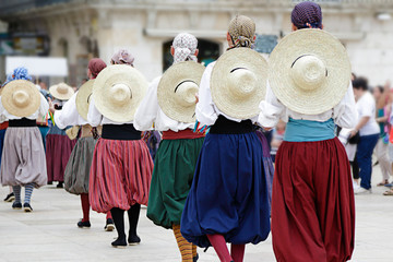 Dancers dancing and wearing one of the traditional folk costume from Mallorca (Balearic Islands), Spain.