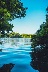 european lake with green trees in the backgroundeuropean lake with green trees in the background