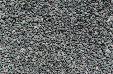 Texture of the earth. Natural dark background. Fine pebbles. Dirt road. Marble stones