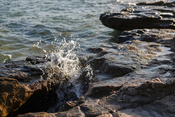  Sea, waves and rocks, spray of the sea, sunset light