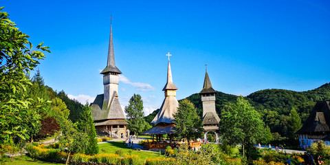 Fototapeta na wymiar BARSANA MONASTERY - AUGUST 16. Unidentified tourists visiting Barsana monastery on August 16, 2019. Maramures area, Romania