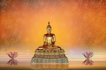 Buddha statue in water pond and lotus flowers  on abstract background orange colors