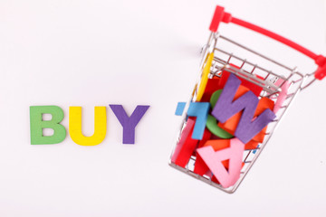 Wooden block on mini trolley wrting BUY