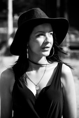 Black haired lady with black hat