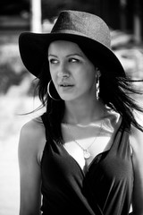 Black haired lady with black hat