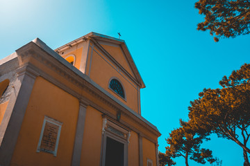 orange church building with tree by the sideorange church building with tree by the side