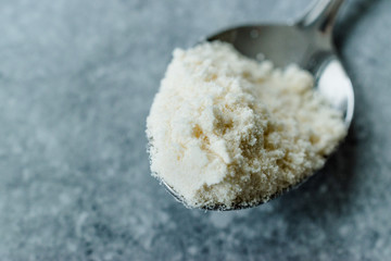 Coconut Flour in Metal Spoon Ready to Use.