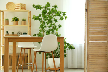 Stylish room interior with beautiful wooden furniture