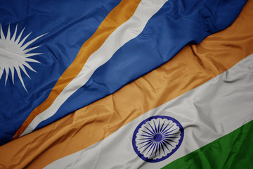 waving colorful flag of india and national flag of Marshall Islands.