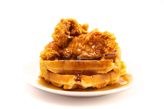 Pile of Chicken and Waffles Isolated on a White Background