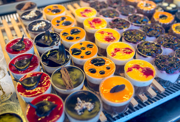 Different colorful creamy cookies on the street market