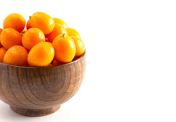 Bowl of Fresh Kumquats Isolated on a White Background