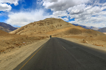 Fototapeta na wymiar scenic landscape of road, mountain and sky in leh & ladakh, India