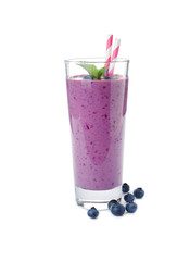 Glass of delicious blueberry smoothie with mint and straw on white background