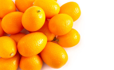 Pile of Kumquats Isolated on a White Background