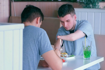 Independent Invalid with disabilities. Disabled man with two amputated stump hands meets friend...