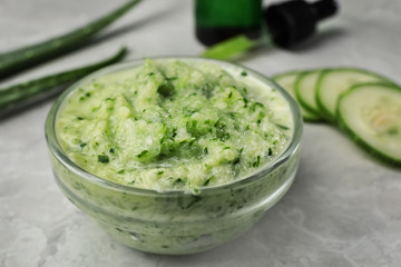 Handmade face mask and ingredients on light marble table, closeup