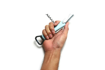 a light blue vintage style  wine opener  in adult hand ton white  background isolated