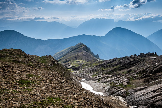 Shades of blue over the different valley and mountain ranges near the Ecrins National Park, French Alps