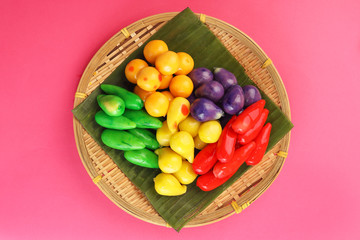 Colourful Luk chup look choop tadeonal Thai desert sweets candy creatve variety bamboo plate banana leaf