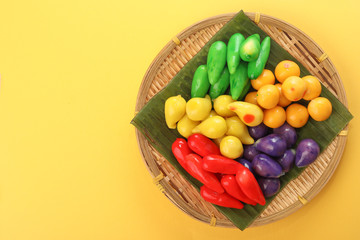 Colourful Luk chup look choop tadeonal Thai desert sweets candy creatve variety bamboo plate banana leaf