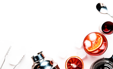 Negroni alcoholic cocktail with dry gin, red vermouth and red bitter, bloody orange slice and ice...