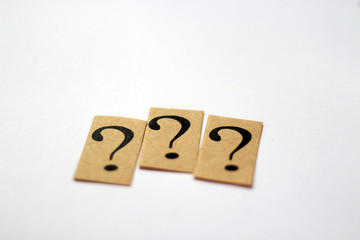 three question marks on white background