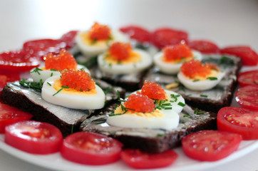 Rye bread sandwich with fish, egg and dill and caviar.Estonian traditional delicacy "kiluvoileib" / "kiluvõileib"