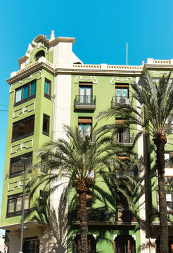 Downtown of Alicante city in Spain at Costa blanca historical building on central Maisonnave avenue green palm trees blue sky