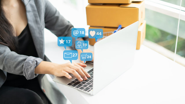 Young asian woman using smart phone,man relaxing and using smartphone with icon,Social media concept.Finger touching phone with social media concept in coffee shop.