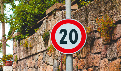 number 20 traffic sign with brick wallnumber 20 traffic sign with brick wall