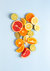 Citrus fruits. Orange, lemon, grapefruit, mandarin and lime on a trendy blue background