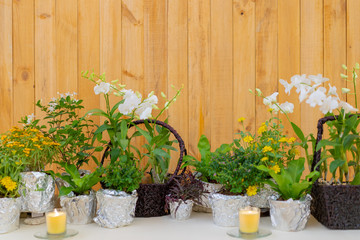 flowers decorate on the dinning long table in the luxury relax event with the wood plate background.