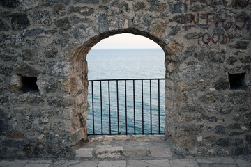 Old door in stone wall