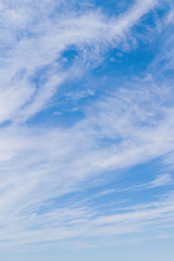 White fluffy clouds in the blue sky in summer