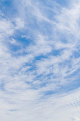 White fluffy clouds in the blue sky in summer