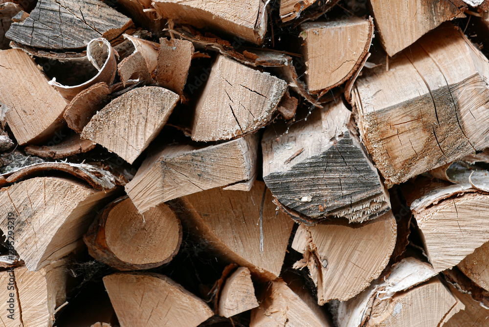 Wall mural beautiful stack of firewood as a background