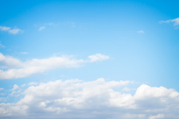 Obraz premium White fluffy clouds in the blue sky in summer