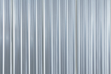 Metal plate sheet fence seamless surface of galvanized steel texture corrugated for wall in a construction site and Industrial building.