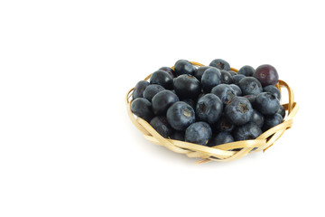 Healthy food blueberries fruit in basket High vitamin Anthocynins benefit for heart and blood circulatory system isolated on white background