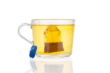 Tea bag in cup isolated on white background