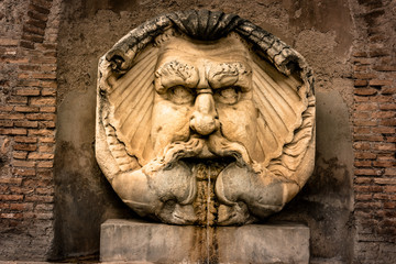 Fototapeta na wymiar Fountain in Rome, Aventine Hill, Italy