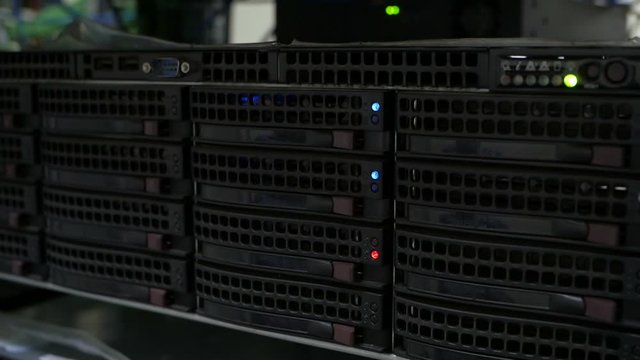 Server hard disk rack. Data server full of working hard drives .