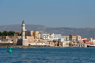 Fototapeta na wymiar Chania, Crete, Greece. June 2019. The Egyptian Lighthouse dating from !6 Century. Renovated in 2005 and sits at the entrance to the Venetian Harbour, Chania