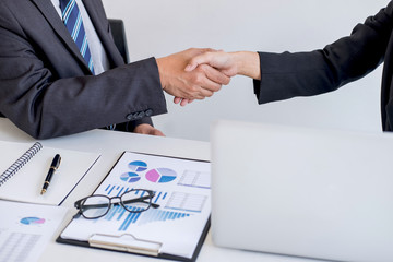 Business partnership meeting, Two confident Business handshake and business people after discussing good deal of Trading contract and new projects for both companies, success, partnership